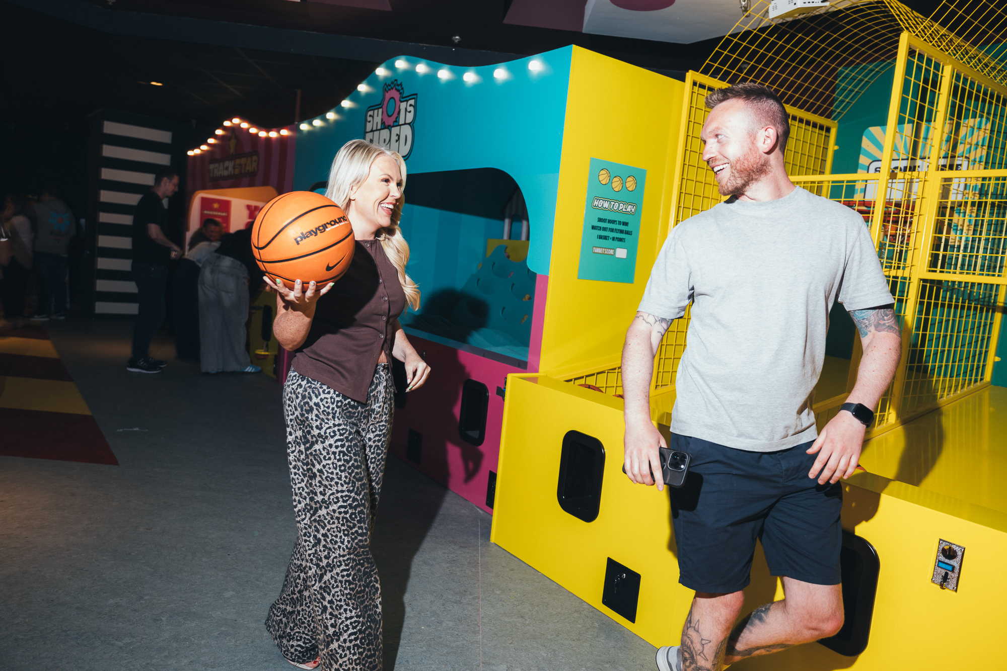 man and woman walking with basketball